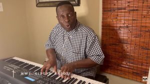 Gideon Kasozi playing piano